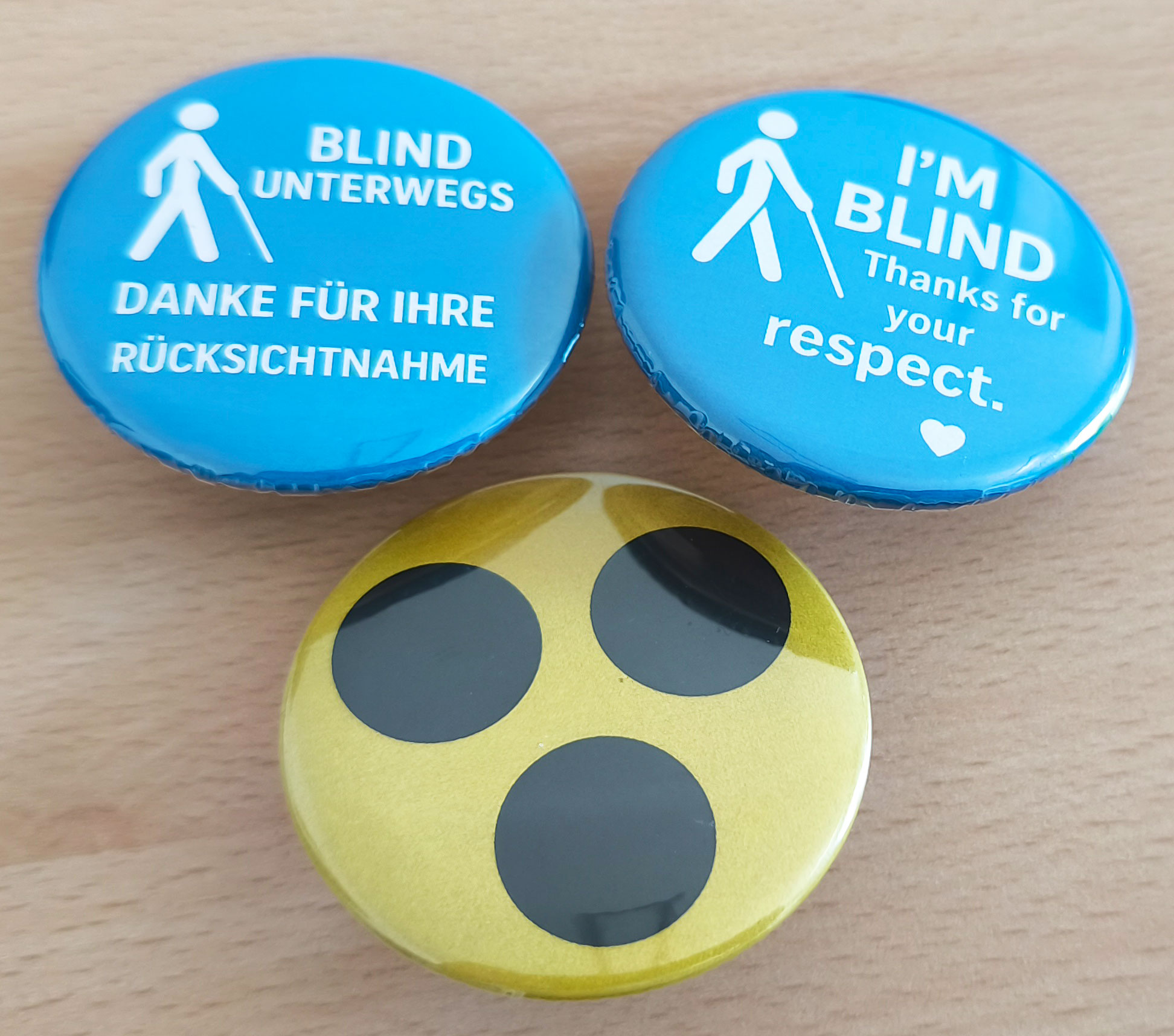 Buttons for blind / partially sighted people